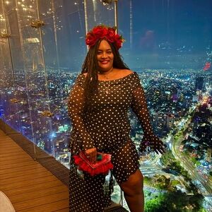 Stylish Black Polka Dot Dress with Red Floral Headband